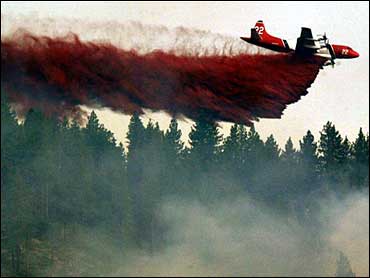 tanker drops retardant on the Waterfall fire in Carson City, Nev.